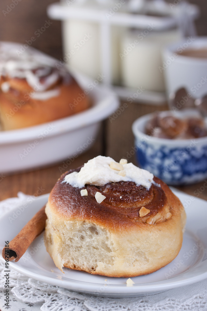 Homemade glazed cinnabons with cinnamon and almonds, american kitchen. . Homemade glazed cinnabons with cinnamon and almonds, american kitchen. .