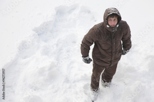 Top view of a man standing in a snowy field