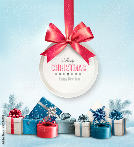 Merry Christmas card with a ribbon and gift boxes. Vector.
