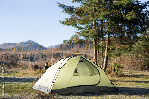 Green tent on mountain top, Retezat mountains, Romania
