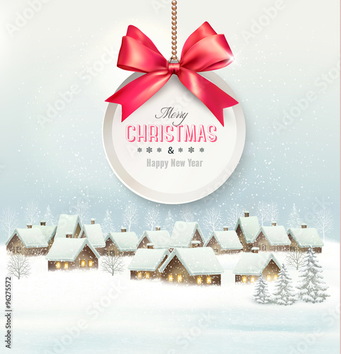 Holiday Christmas background with a village and  gift card with