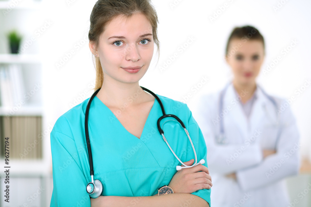 Portrait of young female surgeon doctor in a hospital Portrait of young female surgeon doctor in a hospital
