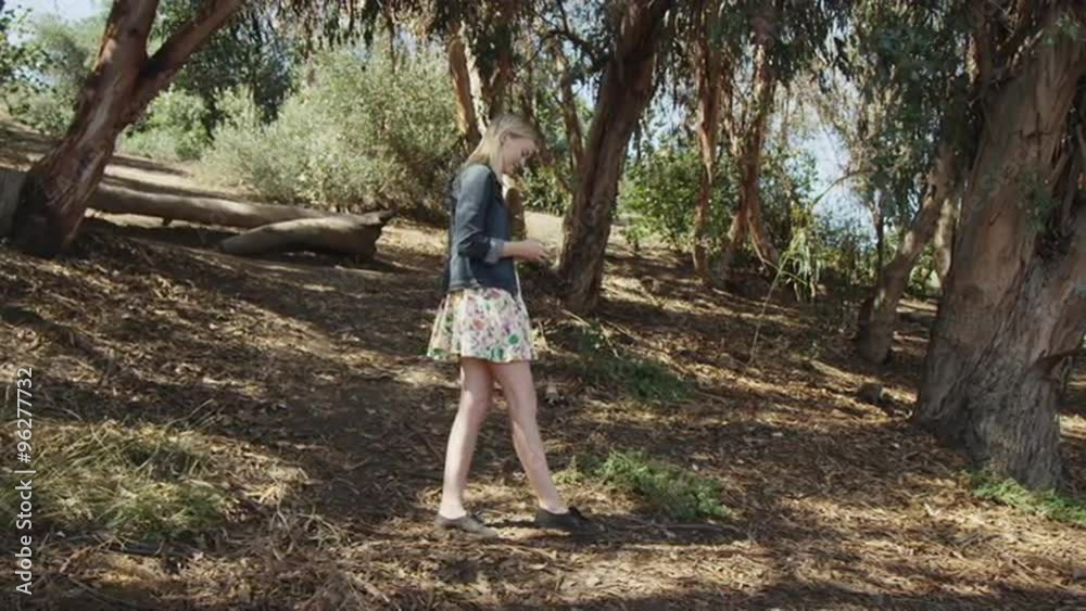 Young blonde woman using smartphone outdoors Young blonde woman using smartphone outdoors