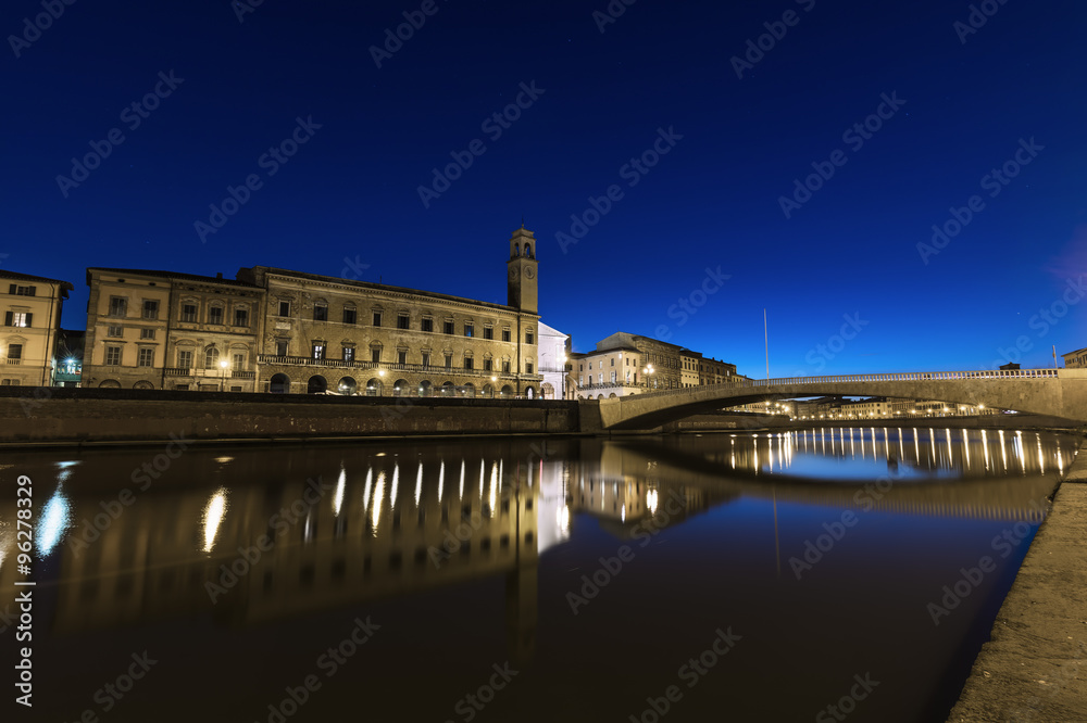 Pisa, Arno river, Ponte di Mezzo bridge. Lungarno night view. Tu