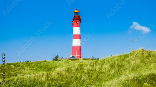 Dune landscape with lighthouse at North Sea