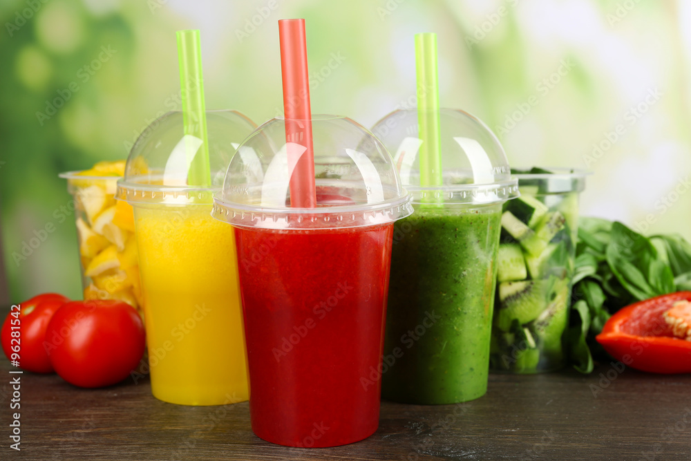 Fresh juice mix fruit, healthy drinks on wooden table, on bright background Fresh juice mix fruit, healthy drinks on wooden table, on bright background