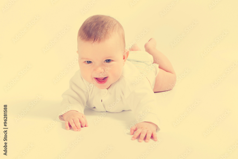 Baby newborn in the shirt closeup on white background. Baby newborn in the shirt closeup on white background.