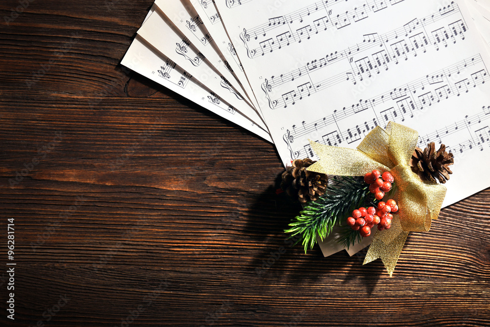 Music and Christmas decor on wooden table