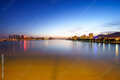 skyline,water and reflection of buildings at dusk © zhu difeng