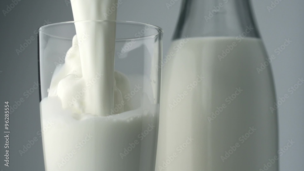 Pouring milk into glass shooting with a high speed camera. 