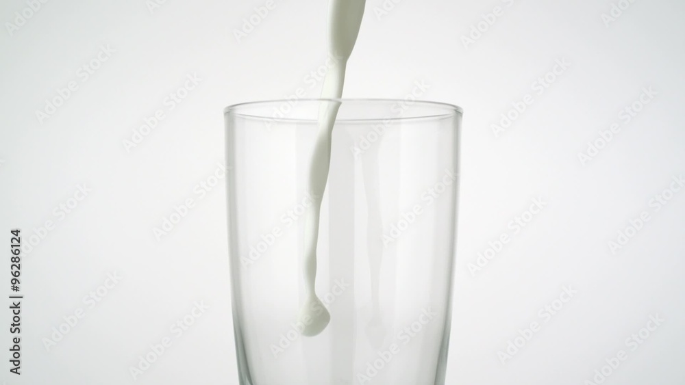 Pouring milk into glass shooting with a high speed camera. Pouring milk into glass shooting with a high speed camera.