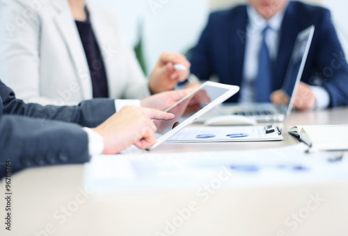 Photography Business adviser analyzing financial figures denoting the progress in the work o