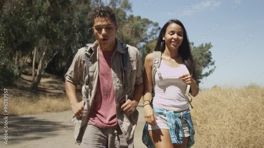 Mexican couple walking on trail Mexican couple walking on trail