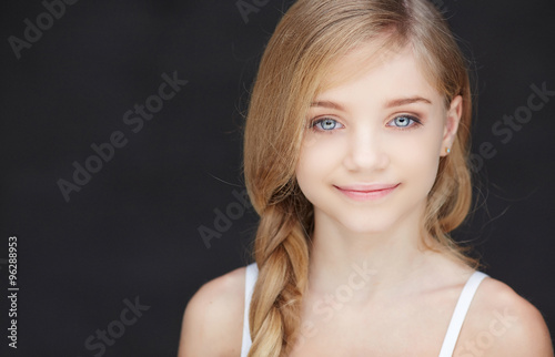 Cute blond girl with blue eyes.