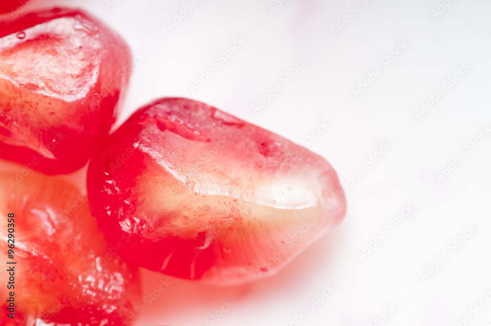 Garnet seeds on the white background. Garnet seeds on the white background.