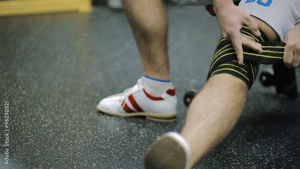 male athletes aged rewinds his knee on the leg hair sport athletic