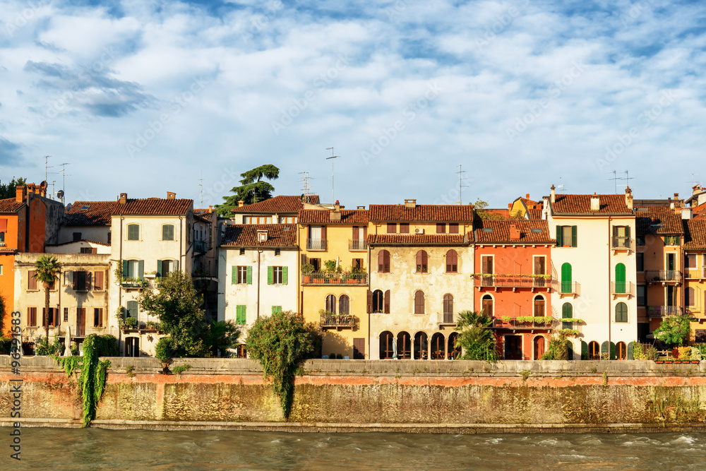Old houses on waterfront of the Adige River. Verona, Italy