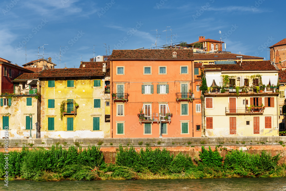 Houses on waterfront of Adige River at historic centre of Verona