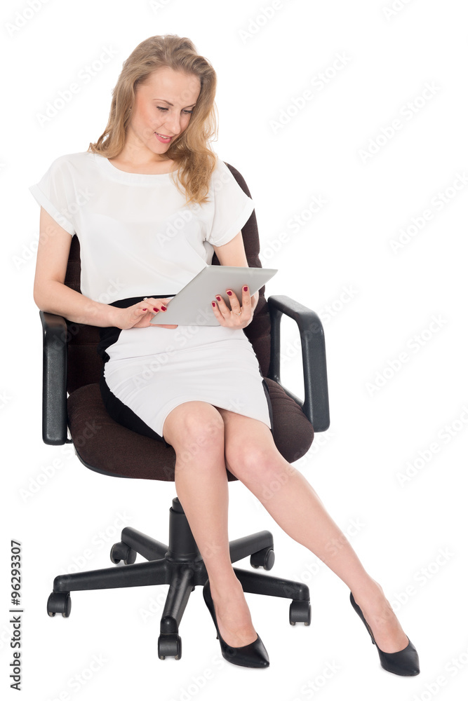 Blonde business woman using on a tablet PC Blonde business woman using on a tablet PC