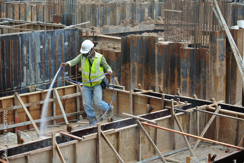 Construction workers spraying the anti termite chemical treatment  photo