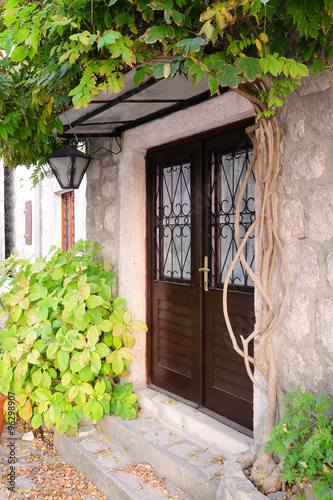 The image of butiful entrance of a stone house photo