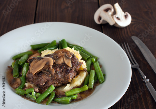 Принти на полотні A plate of salisbury steak with mashed potatoes, green beans and mushrooms