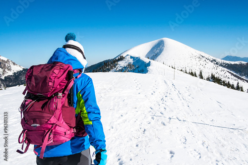 girl walking on snow mountains