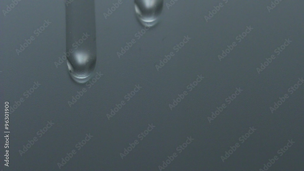 Water dripping down on window glass shooting with high speed camera, phantom flex. Water dripping down on window glass shooting with high speed camera, phantom flex.