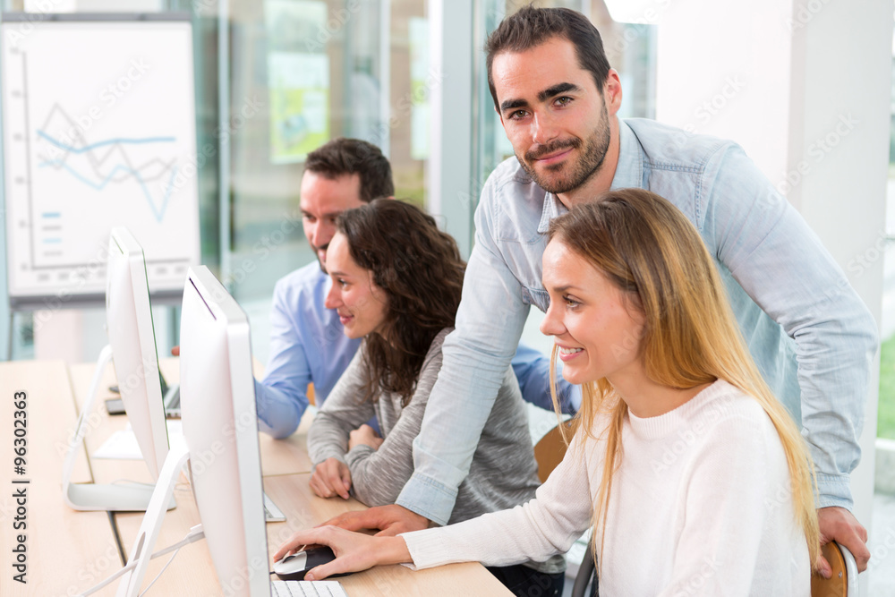 Fototapeta premium Young attractive people taking a training course with formator