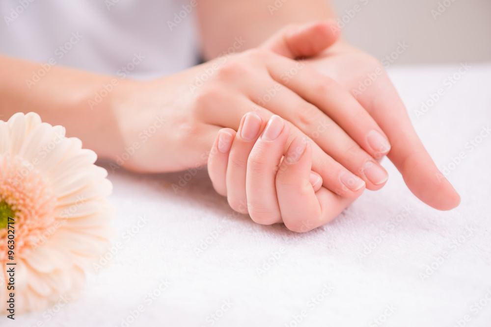Fototapeta premium Pleasant woman making hand massage