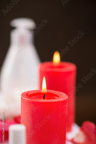 Red candles burning on the table 