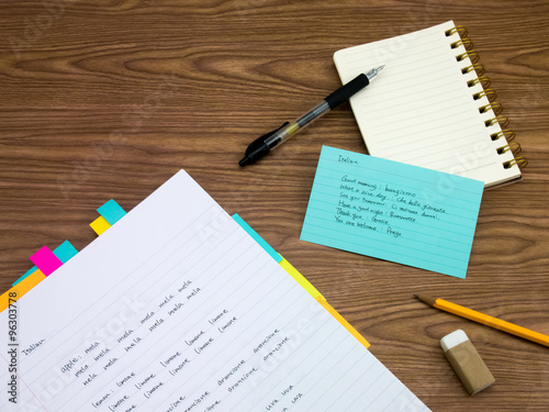 Italian; Learning New Language Writing Words on the Notebook