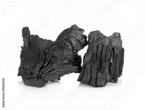 wood charcoal isolated on white background. photo