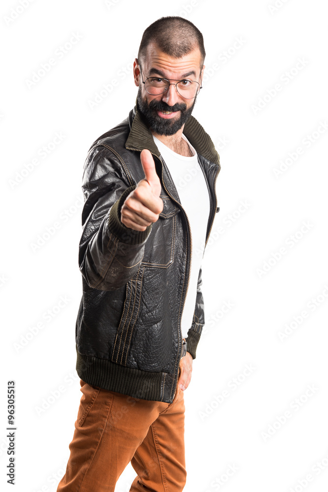 Fototapeta premium Man wearing a leather jacket with thumb up