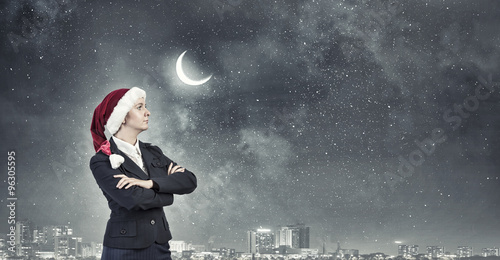 Businesswoman in Santa hat © Sergey Nivens