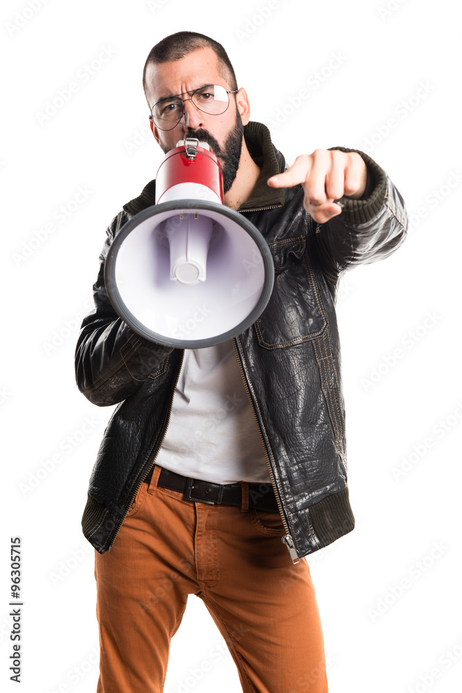 Man wearing a leather jacket shouting by megaphone Man wearing a leather jacket shouting by megaphone