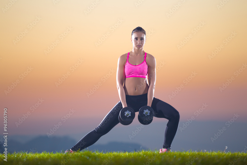 pretty girl outdoor exercise with hand weights