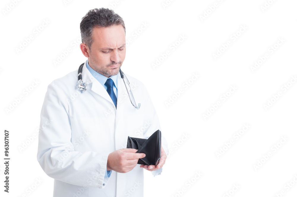 Bankrupt male doctor or medic checking empty wallet Bankrupt male doctor or medic checking empty wallet