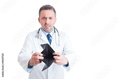 Angry doctor or medic showing empty wallet
