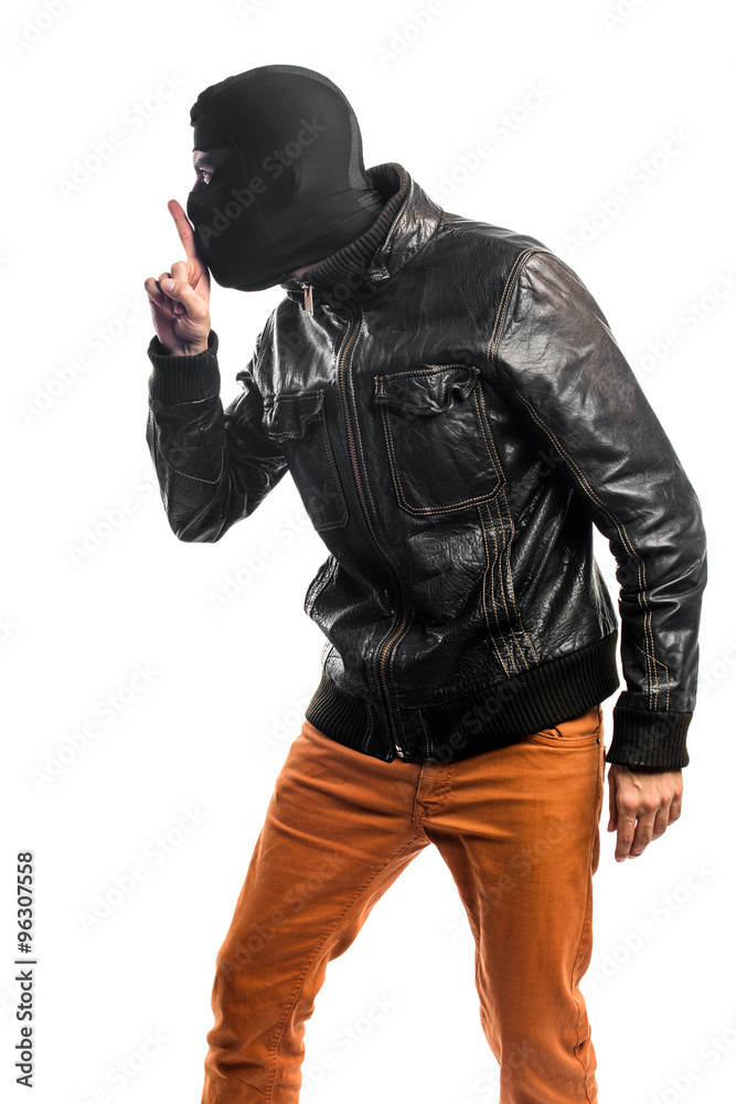 Robber making silence gesture