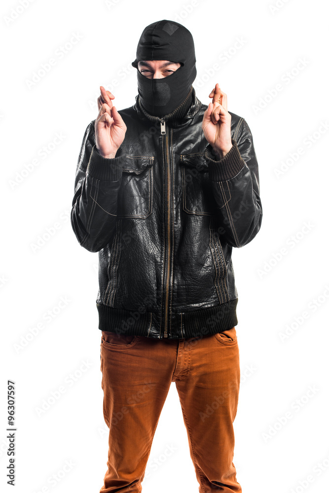 Robber with his fingers crossing Robber with his fingers crossing