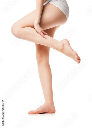 Beautiful wet feet, women legs on white background
