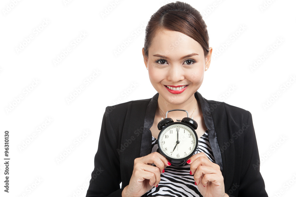 Young Asian business woman smile with a clock Young Asian business woman smile with a clock