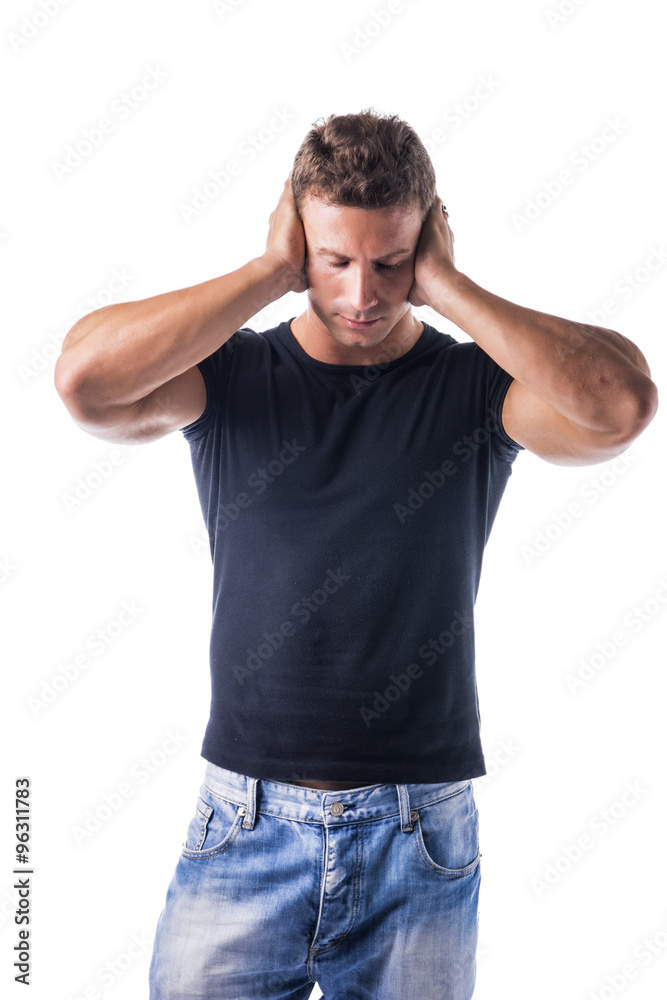 Attractive young man covering his ears, irritated Attractive young man covering his ears, irritated