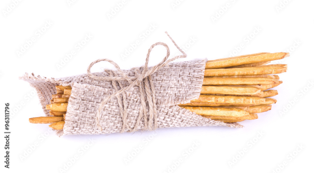 salted sticks tied. Straws in sackcloth isolated. Salty sticks w