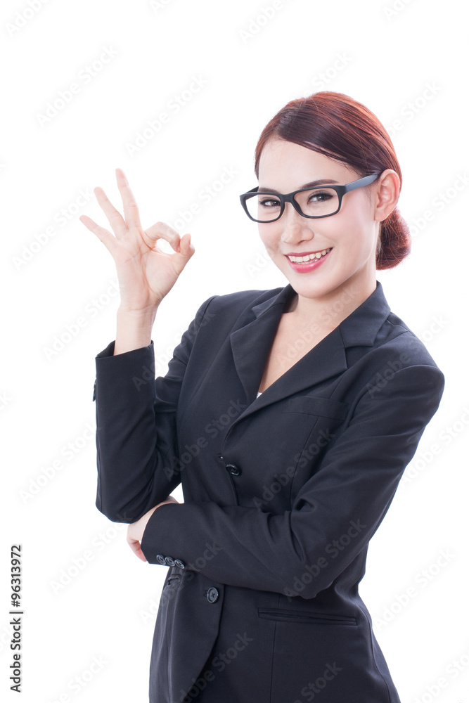 Portrait of young businesswoman wearing glasses showing ok sign. Portrait of young businesswoman wearing glasses showing ok sign.