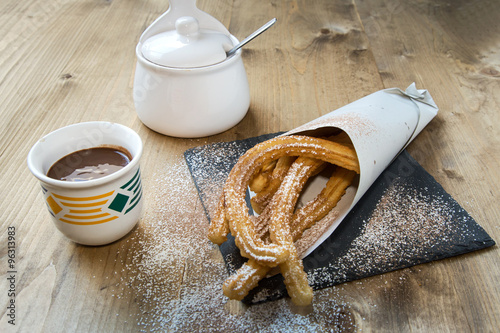 Churros with hot chocolate and sugar
