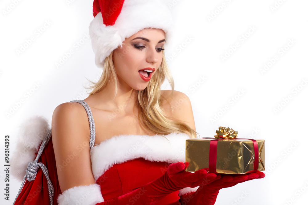 Smiling santa claus woman giving red christmas gift Smiling santa claus woman giving red christmas gift