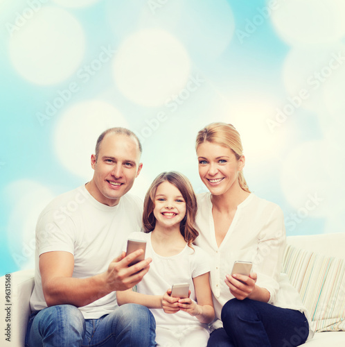 happy family with smartphones