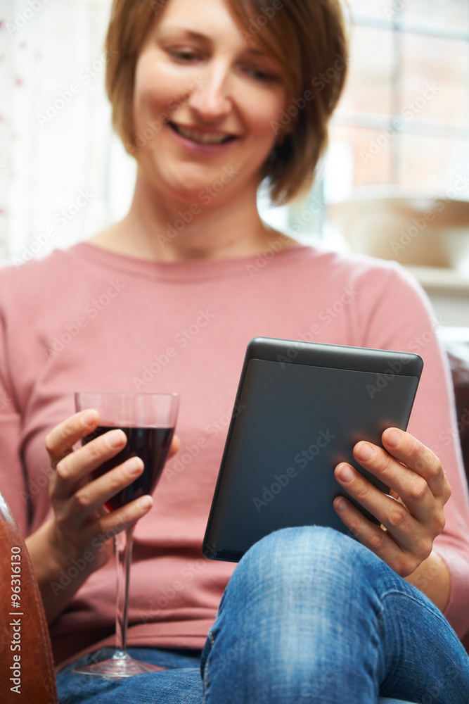 Woman At Home Reading E-Book Drinking Wine Woman At Home Reading E-Book Drinking Wine